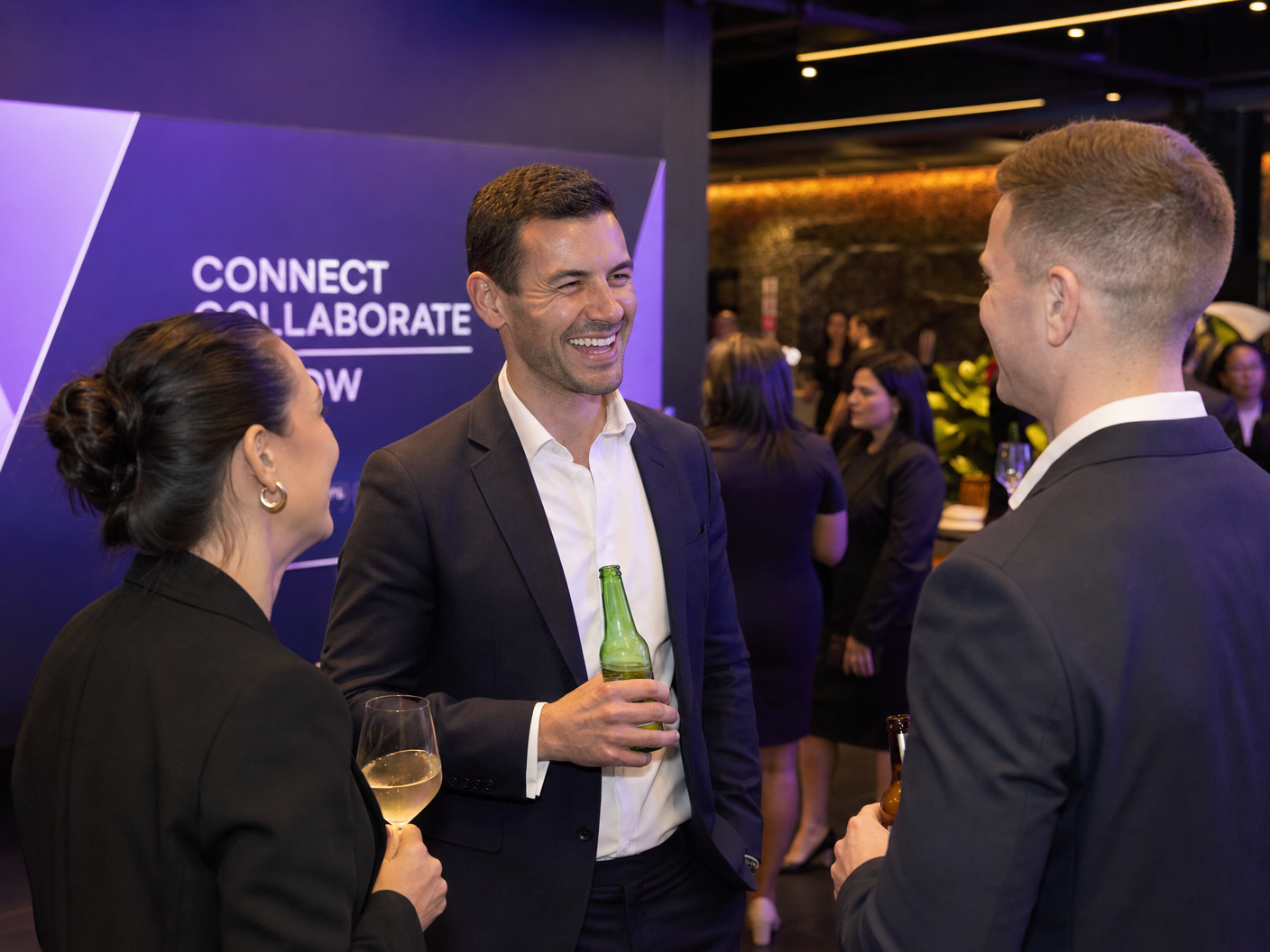 Agents networking at the Academy — genuine conversations and connections being made over drinks